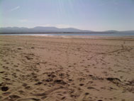 The nearby sandy Newborough beach